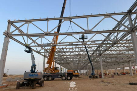 Steel-Frame-Erection-with-Cranes-and-Boom-Lifts-on-Industrial-Site